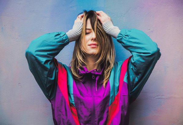 What's the Best Way to Wear a Structured Military-Inspired Jacket with Feminine Flair?